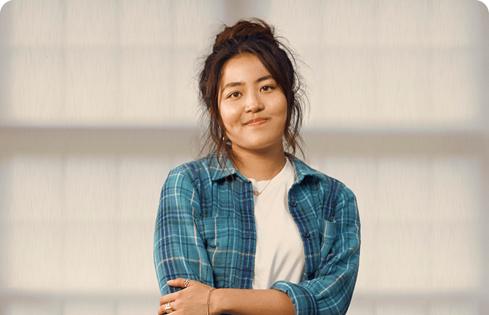 Emily, a 23-year-old woman with ADHD, in her apartment.