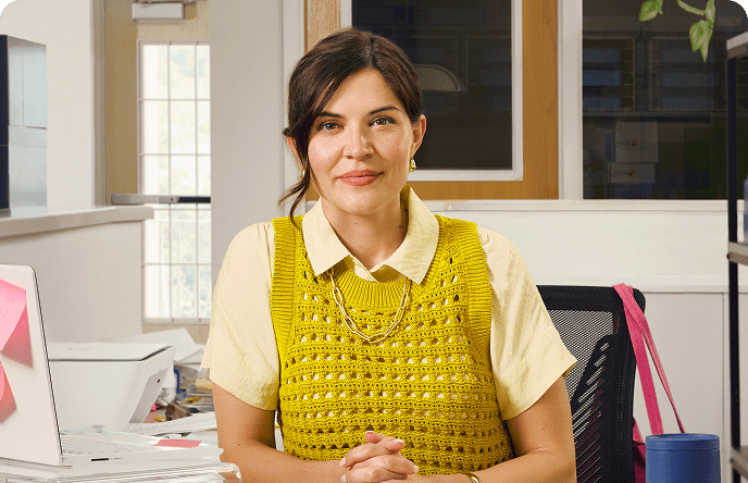 Kate, a 38-year-old woman with ADHD, at her desk.